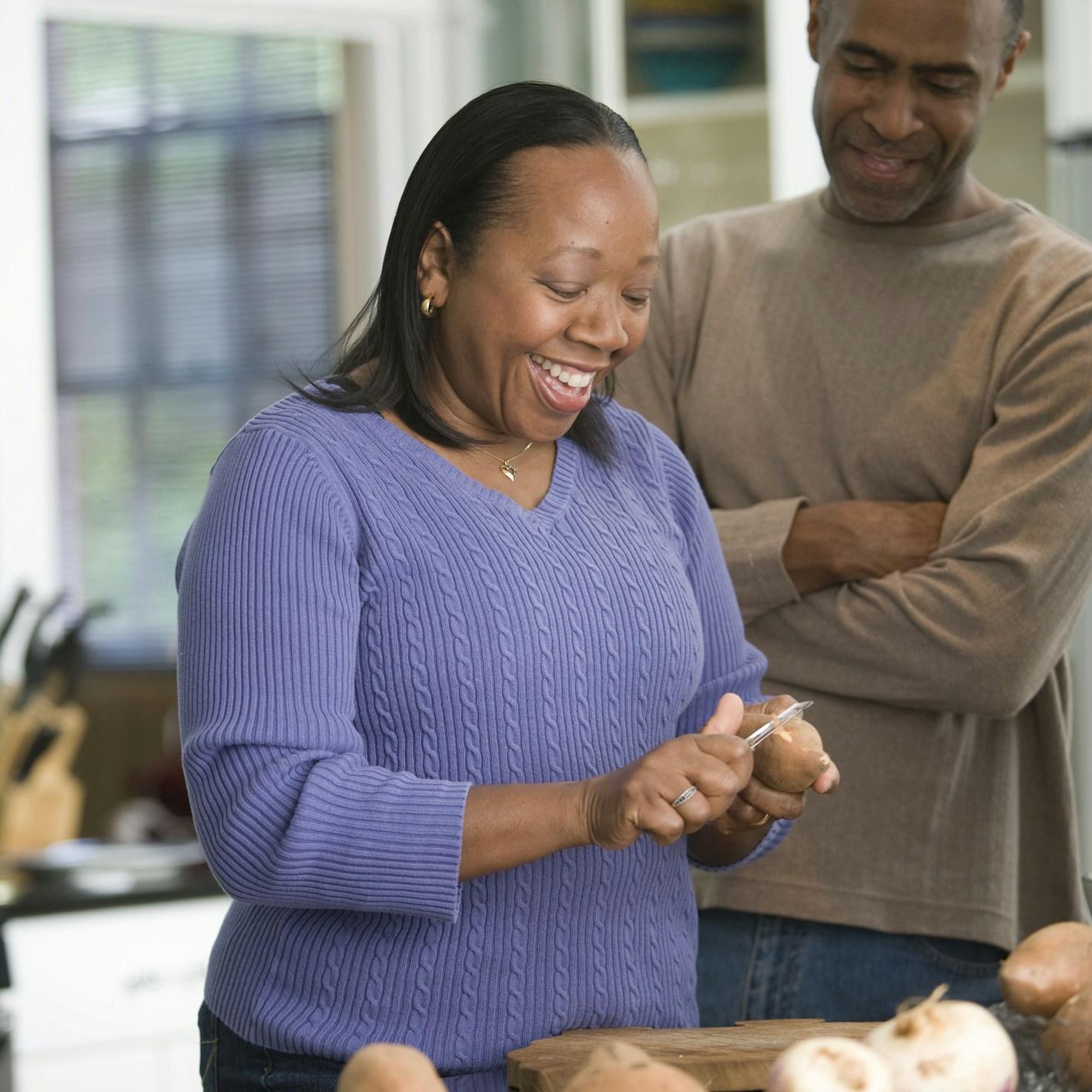 Community members collaborating in a modern kitchen space, sharing recipes and techniques